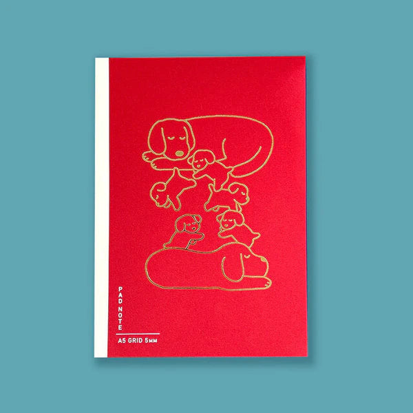 Sikigu red A5 notebook with a gold line drawing of a dog family