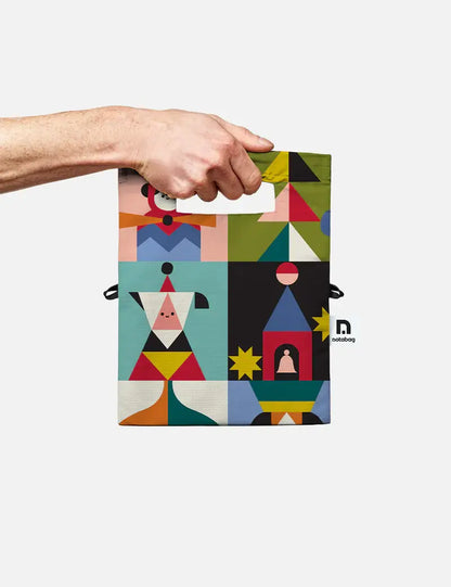 Hand holding the Playground crossbody bag by its cut-out handle