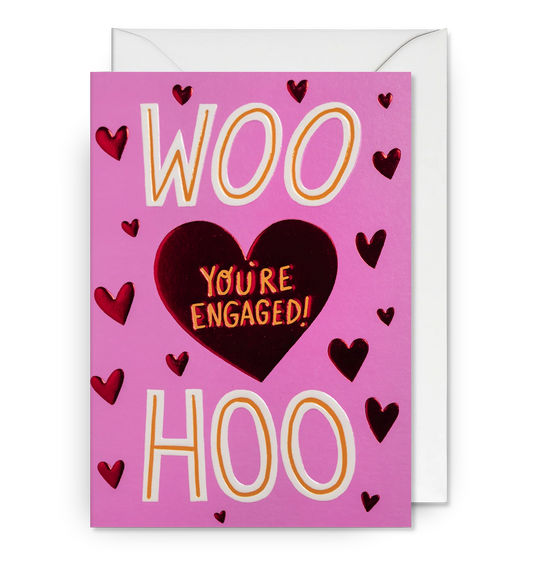 Lagom card: 'Woo hoo' in gold and a heart reading 'You're engaged!' on pink with red hearts