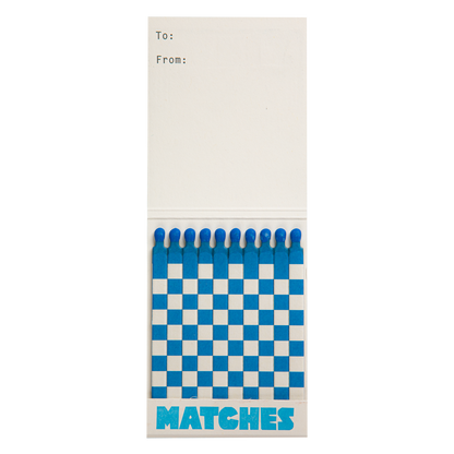 Inside the Paris match book with blue and white matches and a To/From space