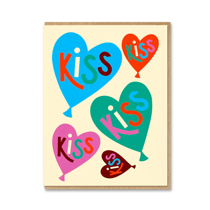 1973 card: heart-shaped balloons in blue, red, pink and teal, each reading 'Kiss'