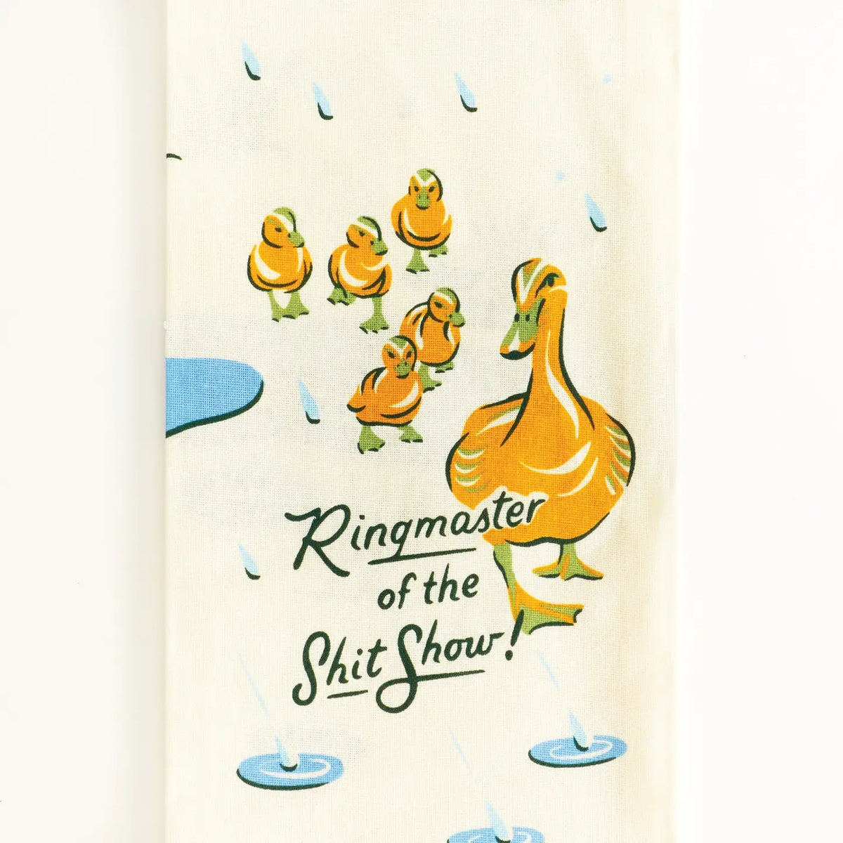 Tea towel, folded: a mother duck leading ducklings in the rain, with 'Ringmaster of the shit show!'