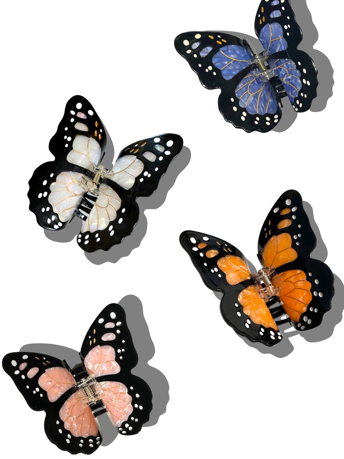 Monarch butterfly claw clips in orange, blue, white and pink