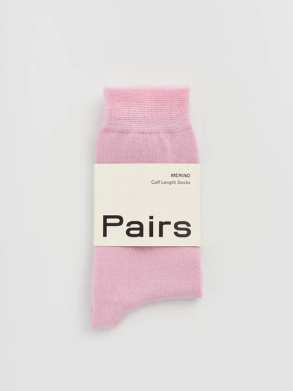 Pairs merino calf socks in sugar pink, medium, with a Pairs paper band