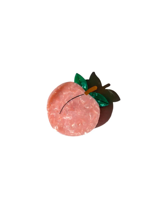 Peach-shaped claw hair clip with green leaves