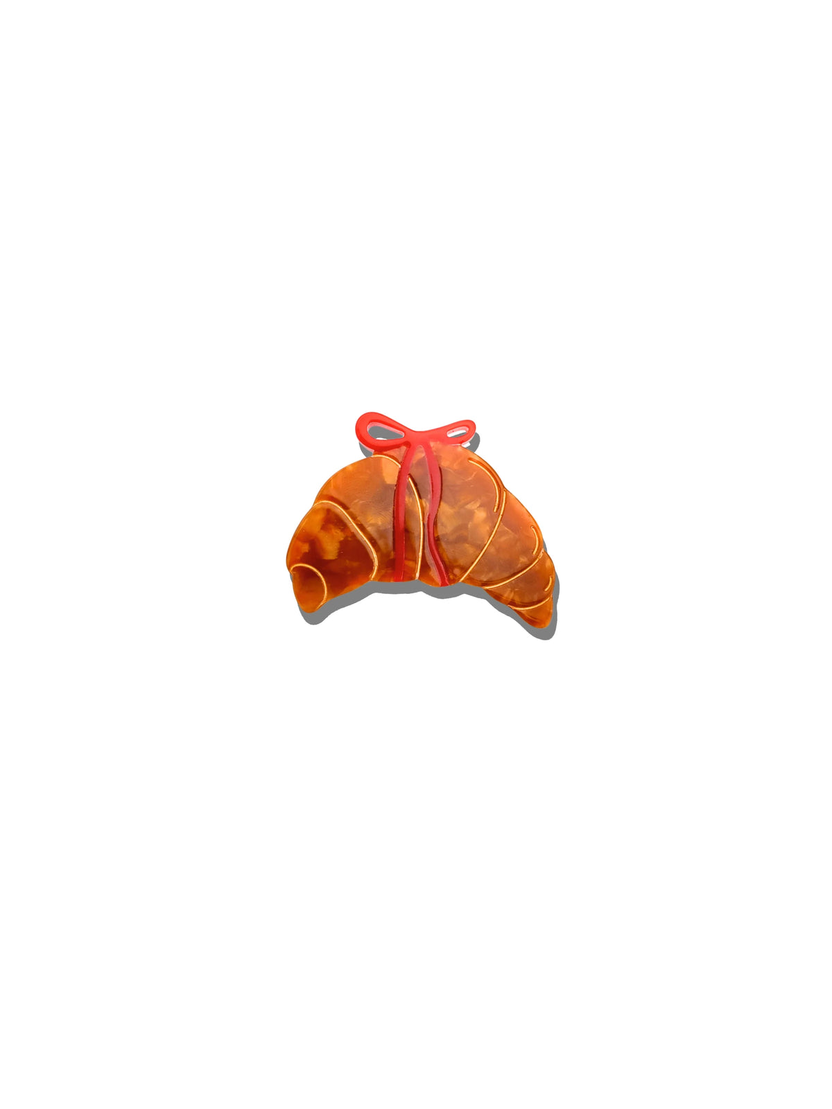 Solar Eclipse croissant brooch with a red bow