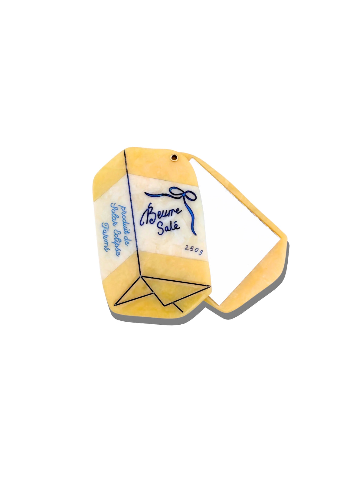 Solar Eclipse compact mirror shaped like a wrapped block of French butter