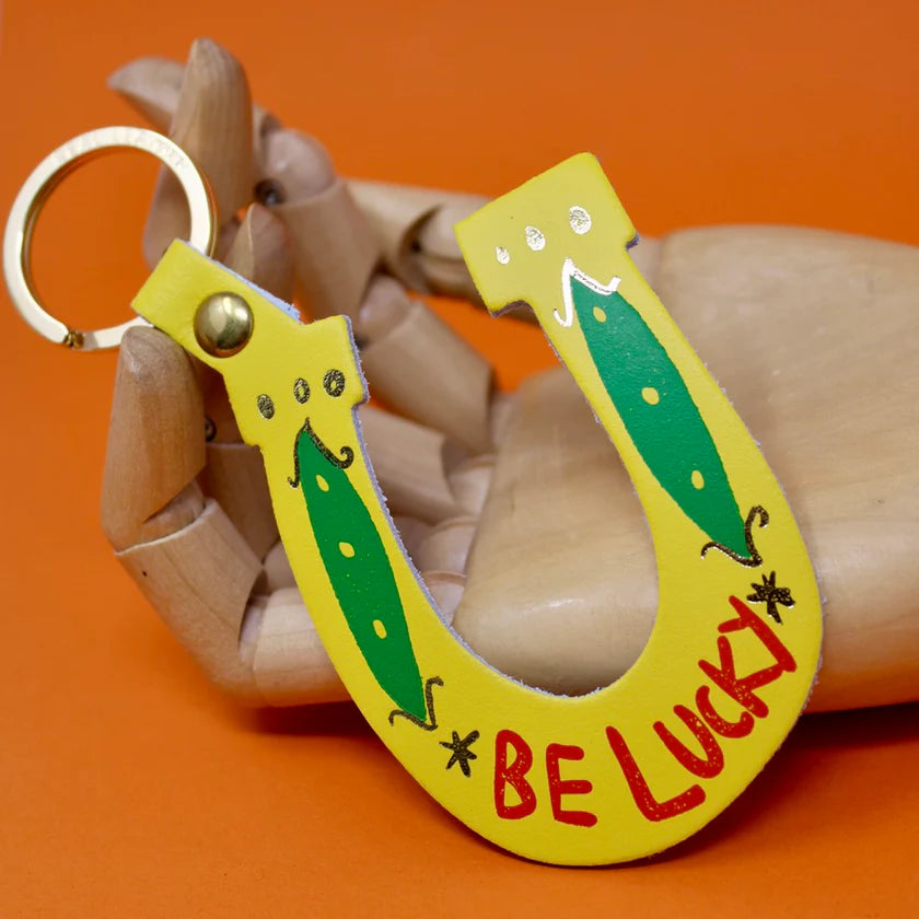 Yellow leather horseshoe key fob with green four-leaf clovers: Be lucky
