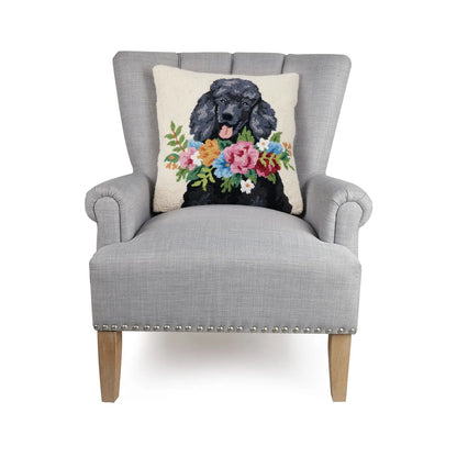 Poodle cushion on a grey armchair