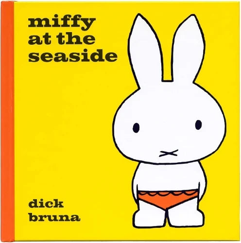 Miffy at the Seaside by Dick Bruna: Miffy in an orange swimsuit on a yellow cover