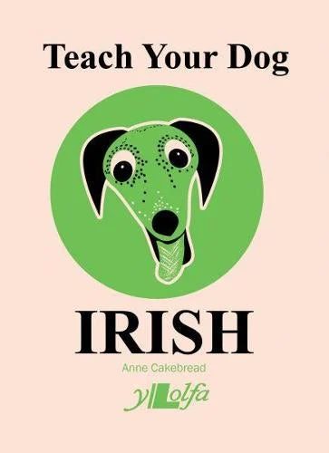 Teach Your Dog Irish book cover: a black dog's face in a green circle on a pale pink background