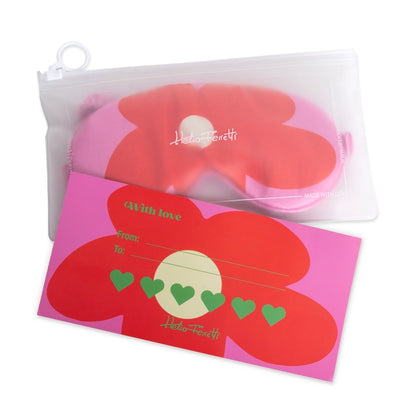 Helio Ferretti satin sleep mask with a large red flower on pink, in its clear pouch with a gift card