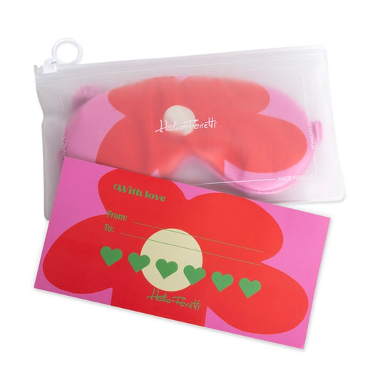 Helio Ferretti satin sleep mask with a large red flower on pink, in its clear pouch with a gift card