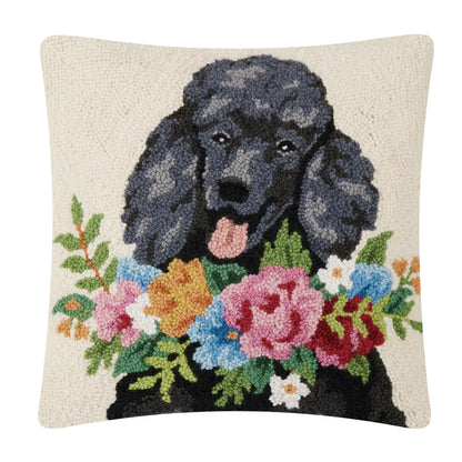 Large hooked wool cushion with a black poodle wearing a garland of flowers