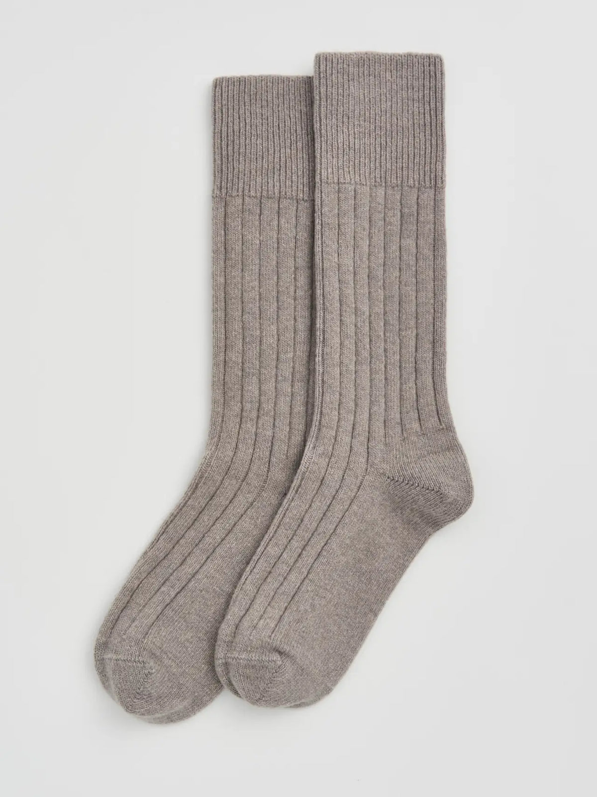 Pair of grey ribbed bed socks laid flat