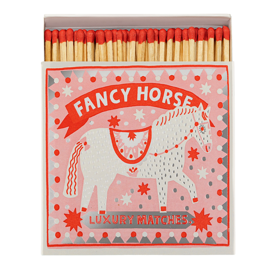 Archivist Fancy Horse matches: a decorated white horse on pink, with red-tipped matches