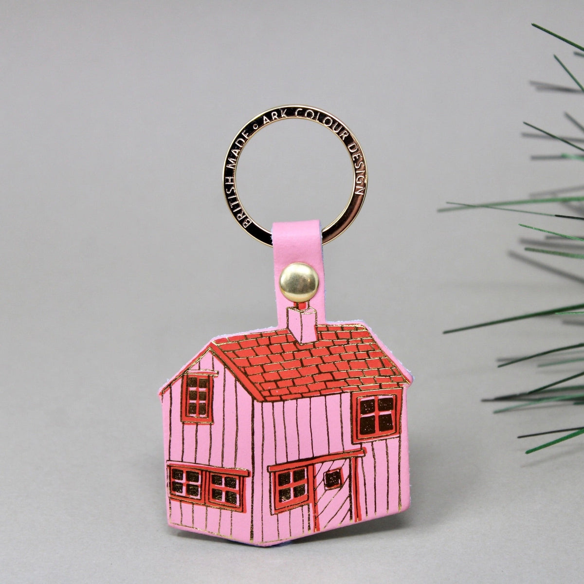 Ark pink leather cabin key ring with a red roof