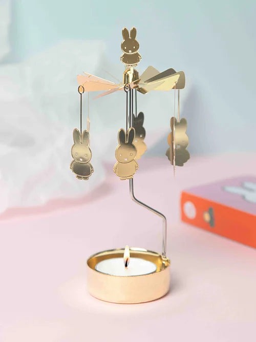 Miffy angel chime: a gold tealight spinner with hanging Miffy figures, lit