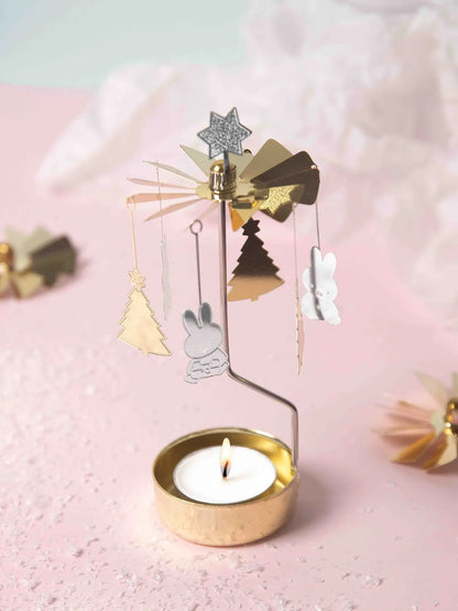 Miffy Christmas chime with a lit tealight on a pink background