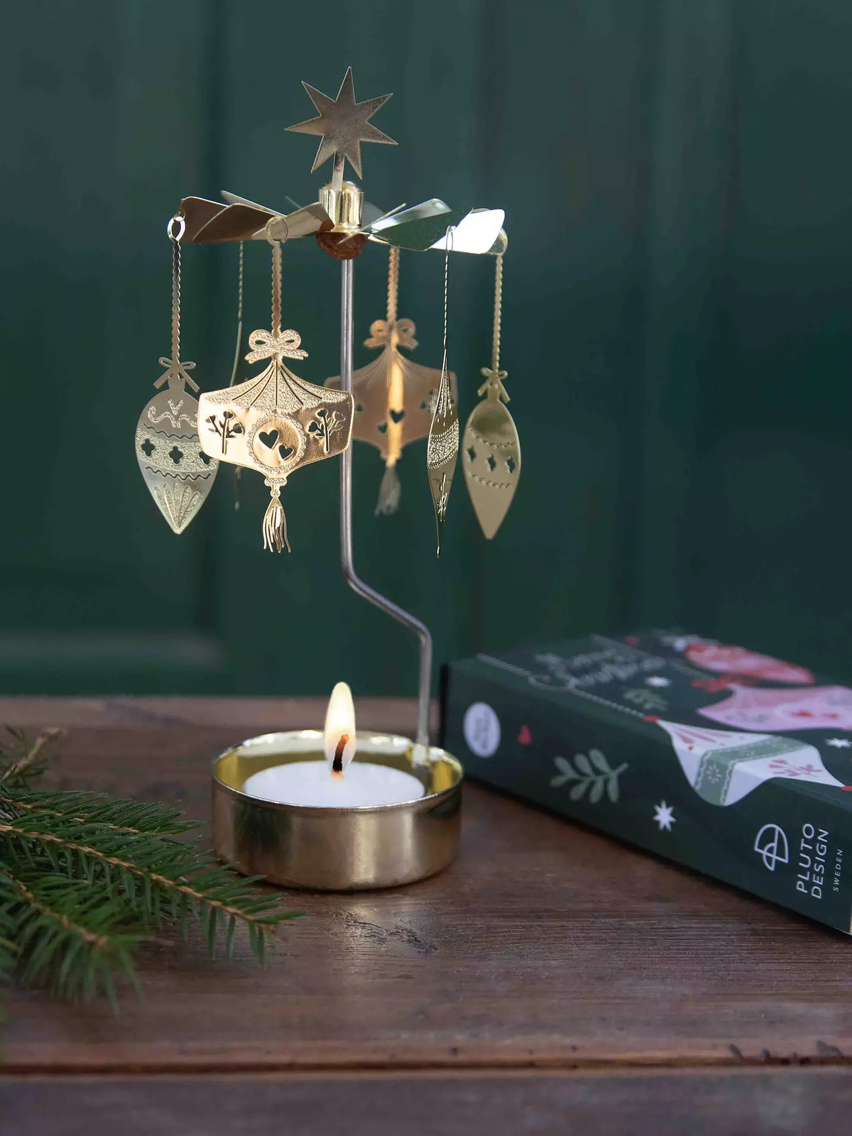 Ornament angel chime lit on a wooden table