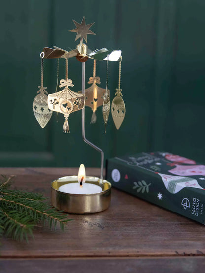 Ornament angel chime lit on a wooden table