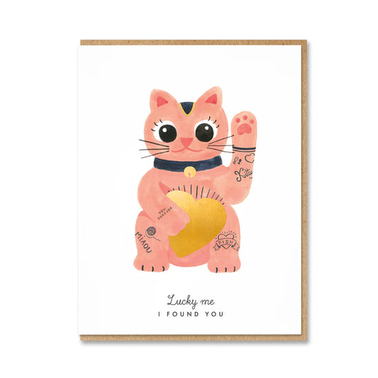 1973 card: a pink lucky cat holding a gold heart, with 'Lucky me I found you'