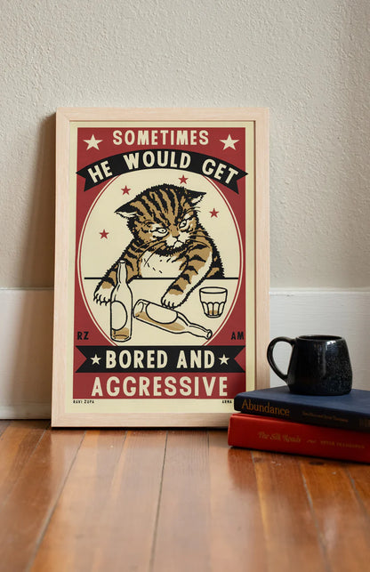 Bored and Aggressive print in a frame on a wooden floor