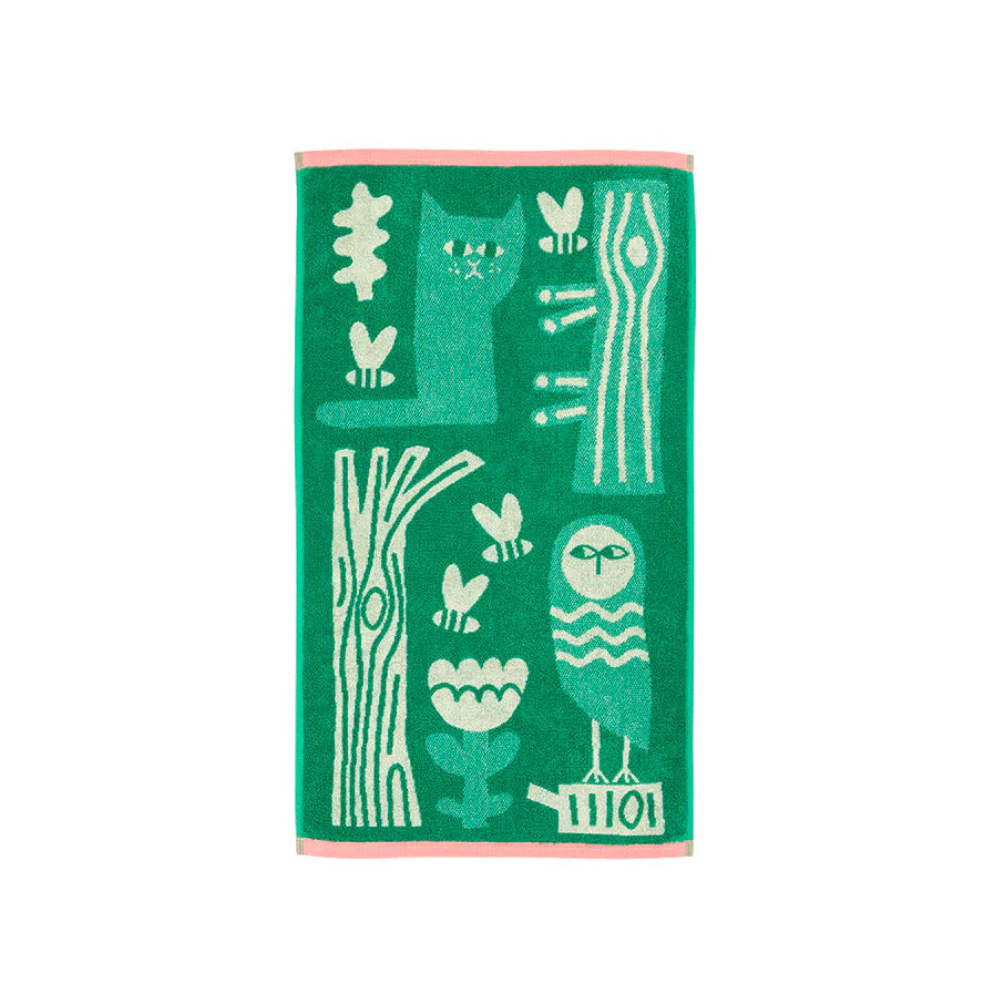 Green hand towel with an owl, a cat, a tree and bees in cream