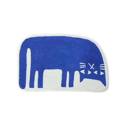 Donna Wilson Lazy Cat bath mat: a blue stretching cat on cream