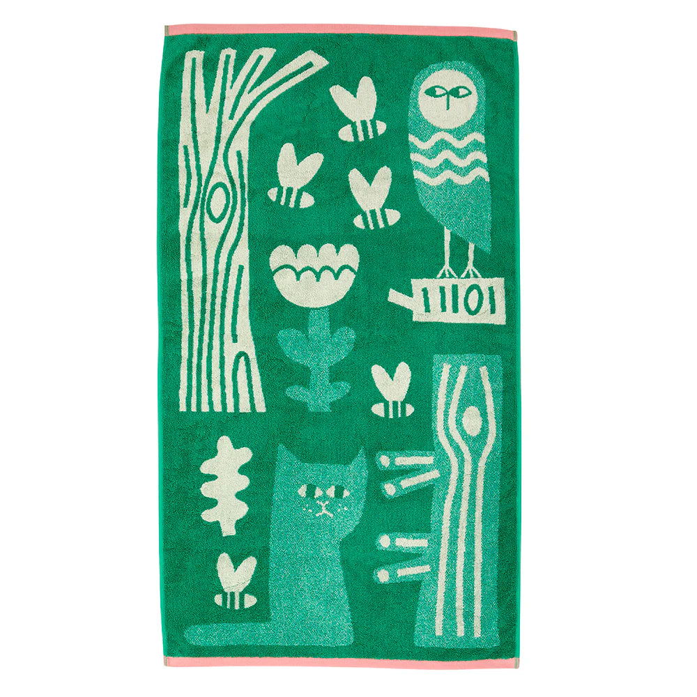 Green bath towel with an owl, a cat, trees and bees in cream
