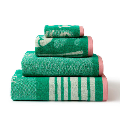 Stack of green Birds and Bees towels in different sizes with pink edges