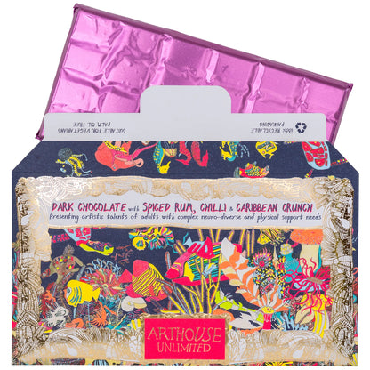 Spiced rum chocolate with its pink-wrapped bar pulled out