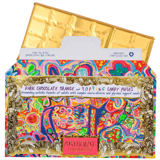Arthouse Unlimited dark chocolate orange and popping candy pieces bar in a colourful wrapper with gold foil
