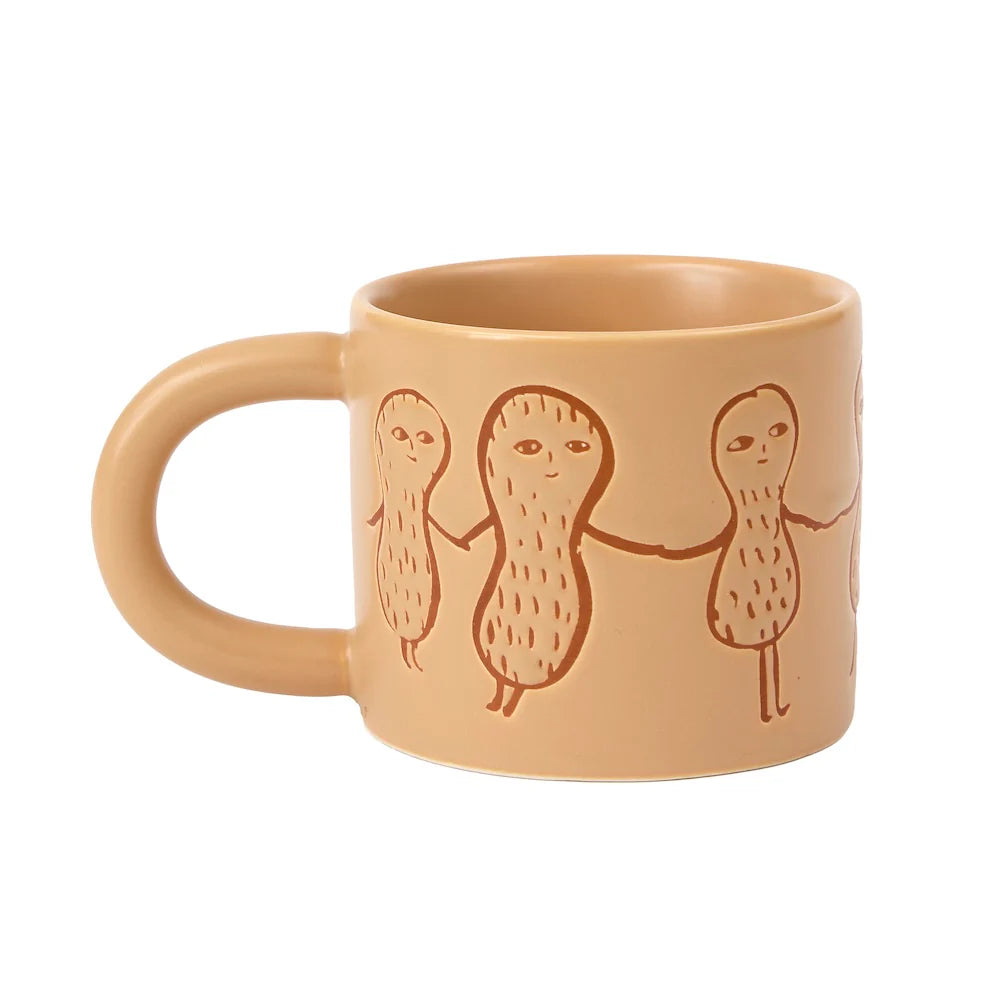Donna Wilson mug in tan with a band of peanut characters holding hands