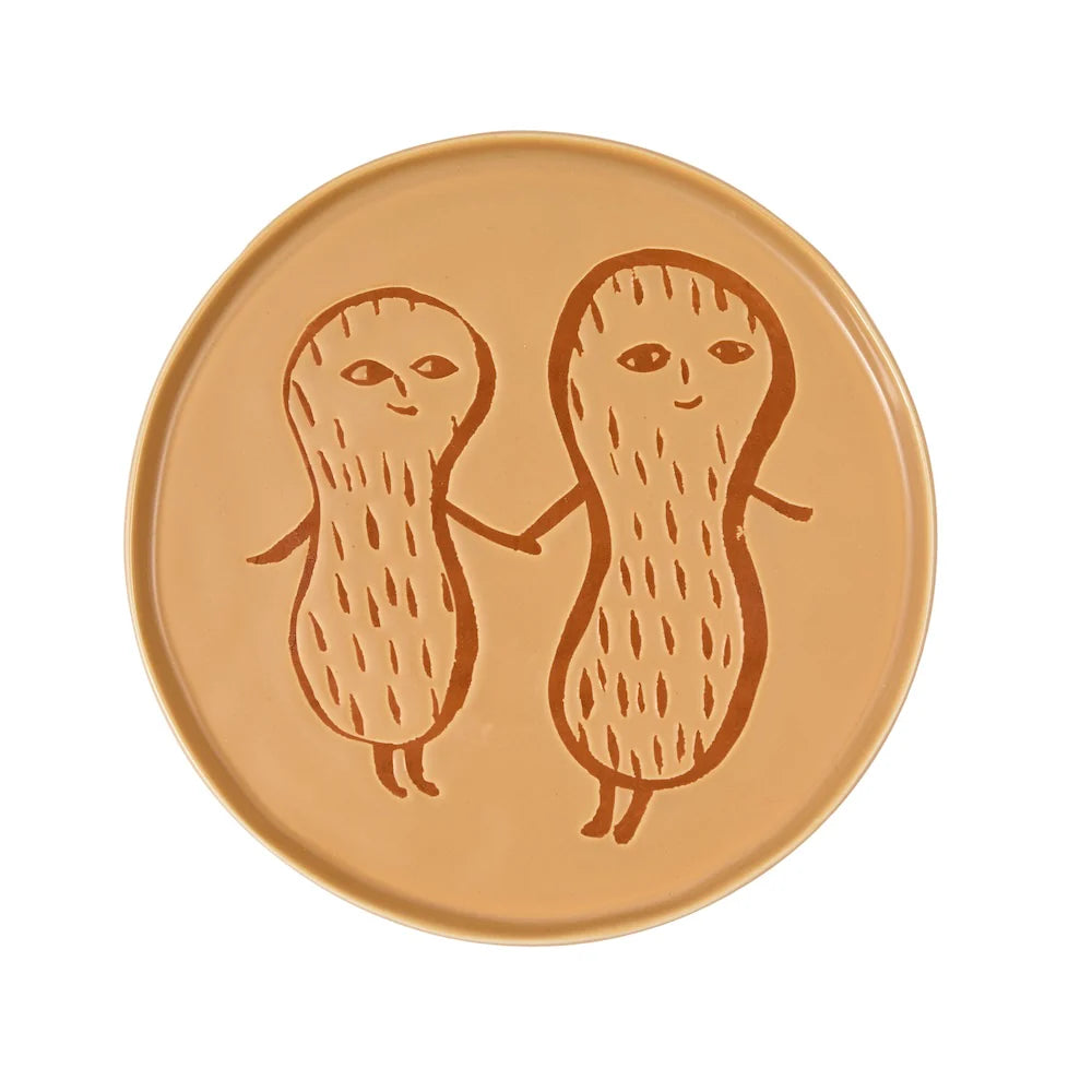 Donna Wilson tan plate with two peanut characters holding hands