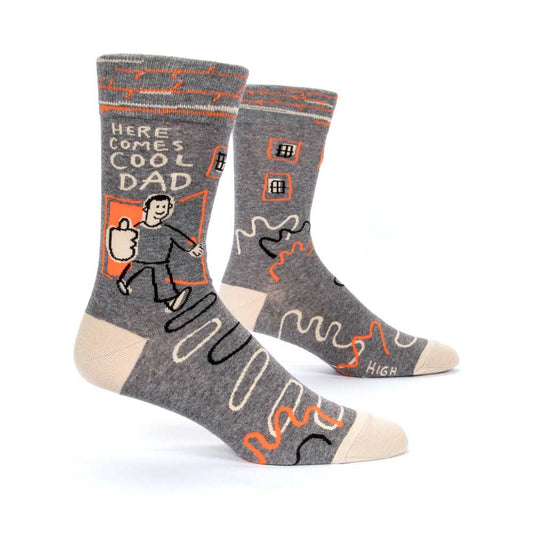 Grey men's socks with a man and orange squiggles: Here comes cool dad