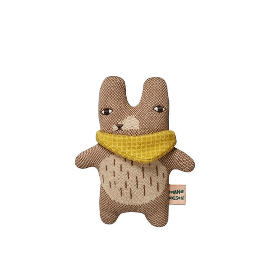 Donna Wilson Teeny Ted: a small knitted brown bear with a yellow scarf