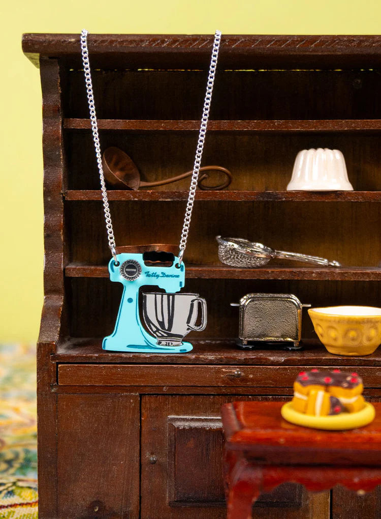 Food mixer necklace in a miniature dresser