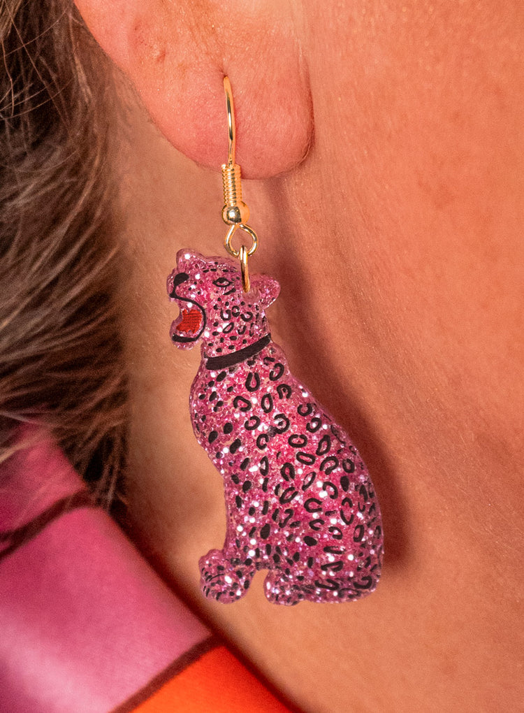 Pink glitter leopard earring worn