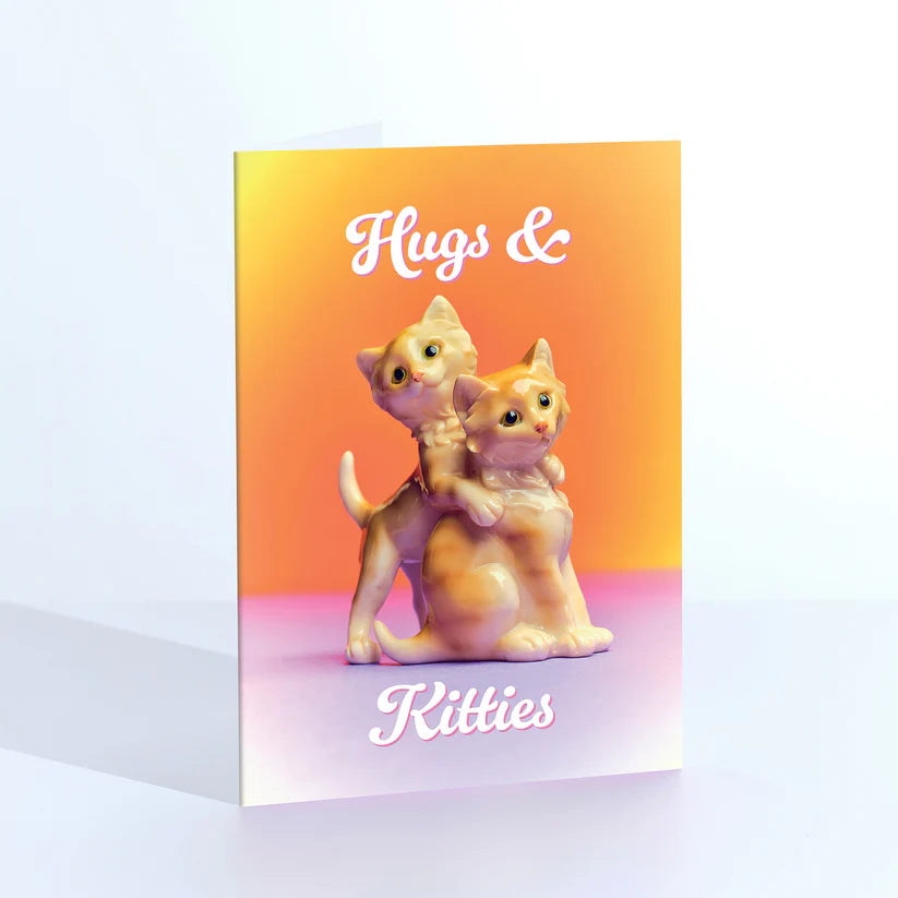 Ornament card: two kitten figurines hugging, with 'Hugs & kitties' on orange