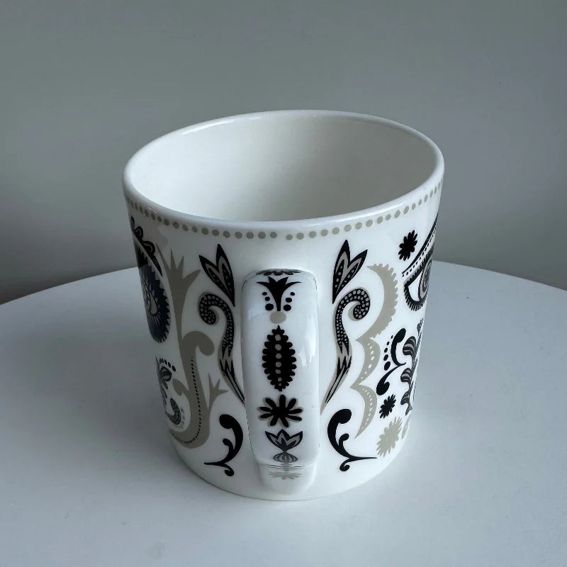 Masquerade mug from the side, showing the patterned handle