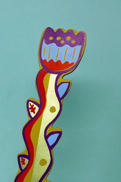 Ark apple green tulip bookmark with a purple and blue flower, on teal