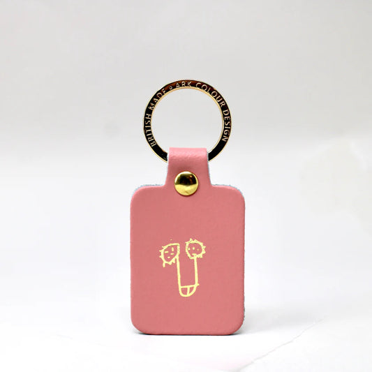 Ark pink leather key fob with a gold-printed cheeky doodle
