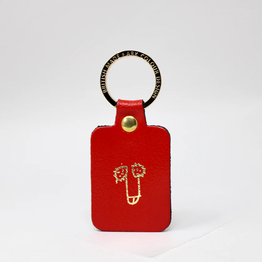 Ark red leather key fob with a gold-printed cheeky doodle