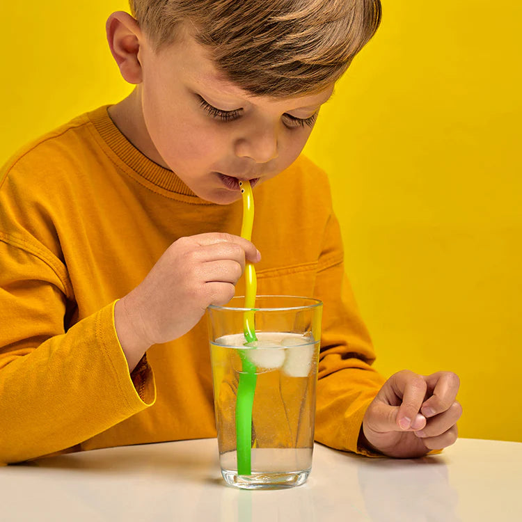Child drinking water through a wiggly worm straw