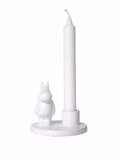 White porcelain candle holder with a small Moomintroll figure and a white candle