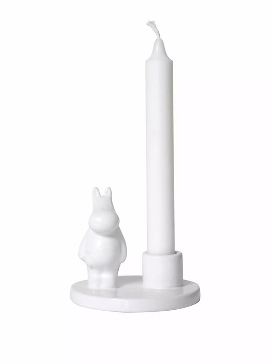 White porcelain candle holder with a small Moomintroll figure and a white candle
