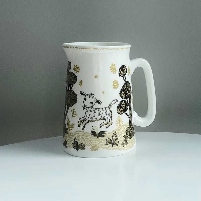 Lush Designs jug with a leaping lamb among dark trees and gold flowers
