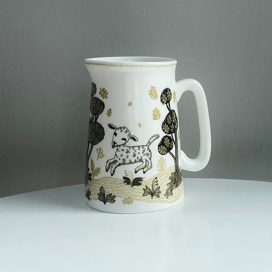 Lush Designs jug with a leaping lamb among dark trees and gold flowers