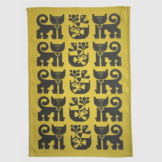 Magpie x Hornsea gold tea towel with a pattern of black cats and piranhas